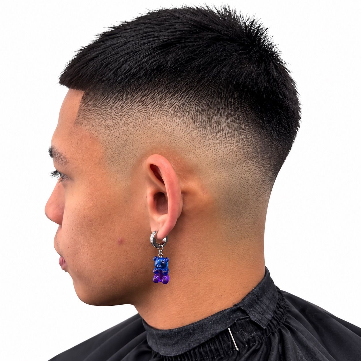 High drop fade with a short textured crop, left profile
